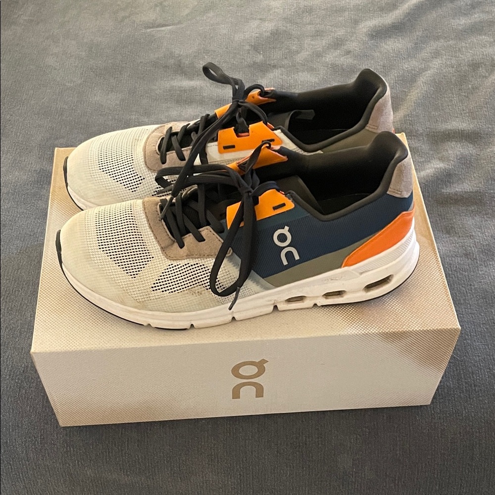 On Running Women’s Sneakers in Cream, Blue, and Orange